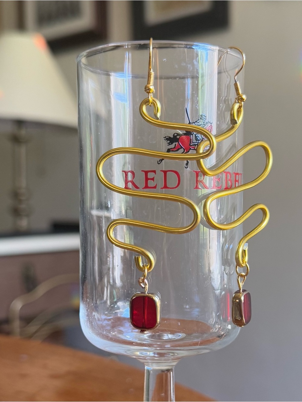 Handmade Gold wire Swirl Earrings with dangling Red Glass beads